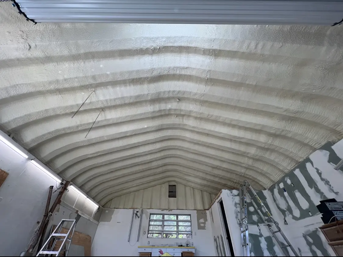 Spray polyurethane foam applied to the underside of a metal roof deck in New Haven